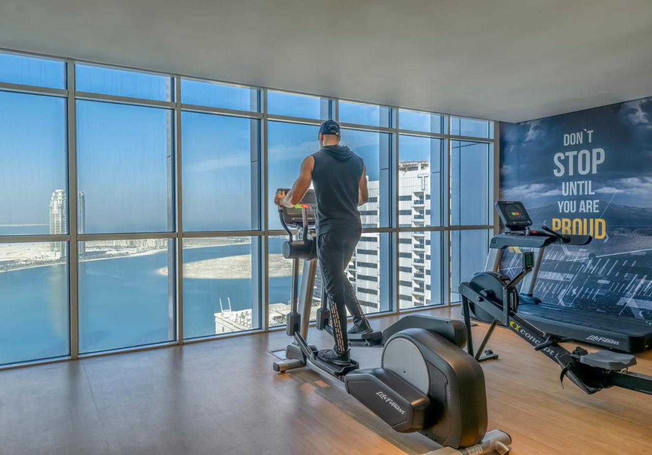 Pullman Sharjah Hotel Екстериор снимка A man using a cross trainer